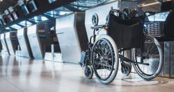 Manual wheelchair at airport check-in counter.