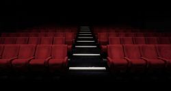 Seats in a darkened movie theater.