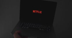 Netflix logo displayed on laptop computer screen.