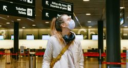 Woman wearing a mask in an airport.