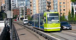 Streetcar rolling amid traffic in Portland, Oregon.
