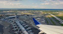 JFK Airport terminal building seen from the window of a departing flight.