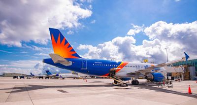 Allegiant Air Airbus A320 parked at gate at Knoxville Airport.