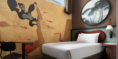 Single bed in wheelchair accessible hotel room.