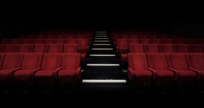 Seats in a darkened movie theater.