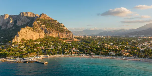 Mediterranean coastline with hills and mountains in Italy.