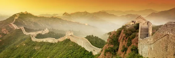 PHOTO: The Great Wall of China set against an orange hued sky.
