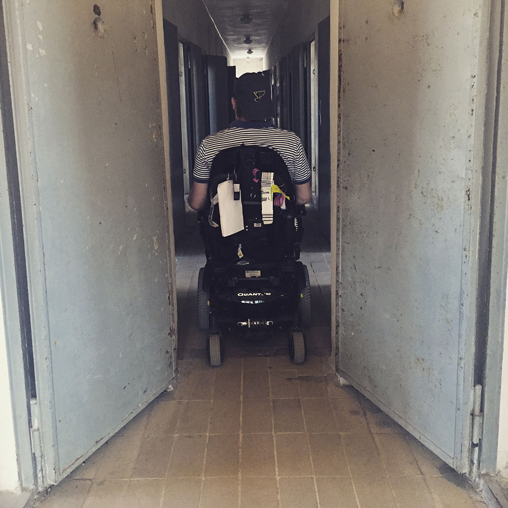 John Morris in wheelchair in Sachsenhausen Prison Barracks