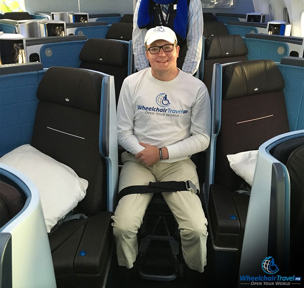 John Boarding An Airplane In An Aisle Chair