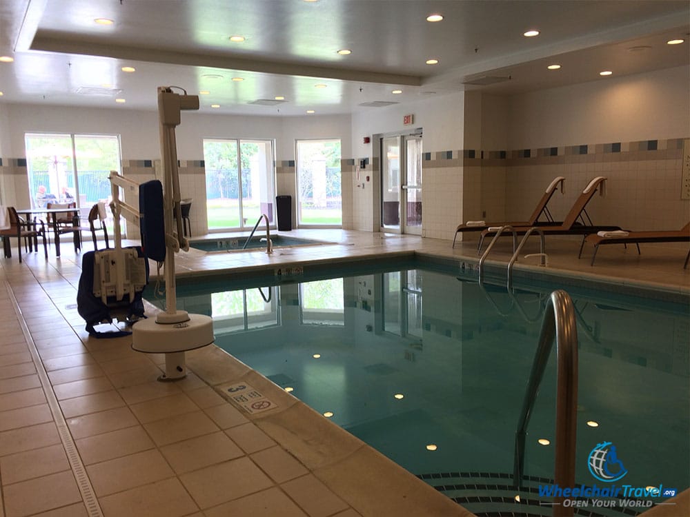 PHOTO DESCRIPTION: Hotel pool with lift for wheelchair users or persons with reduced mobility.