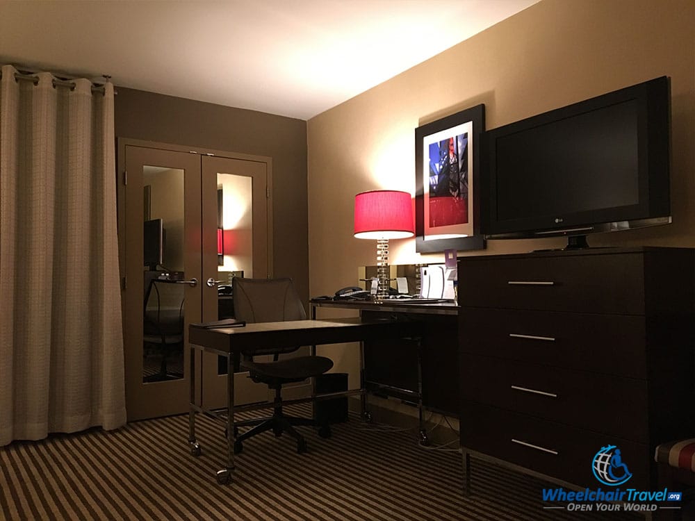 TV, dresser with drawers and desk