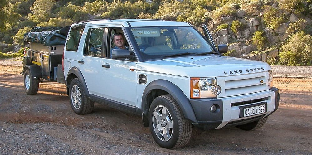 Dave seated inside his Land Rover vehicle.