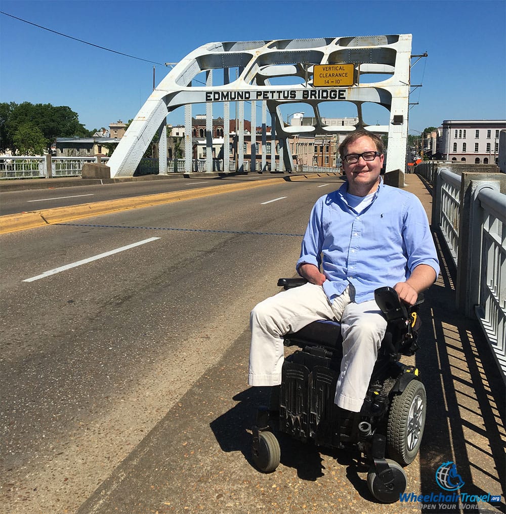 Another angle of wheelchair user John Morris on the Edmund Pettus Bridge