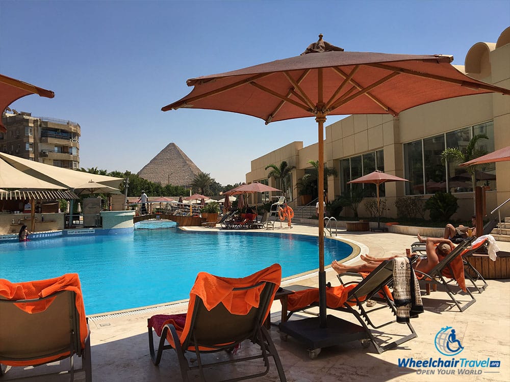Le Méridien Pyramids Hotel swimming pool, with an Ancient Egyptian Pyramid in the background.