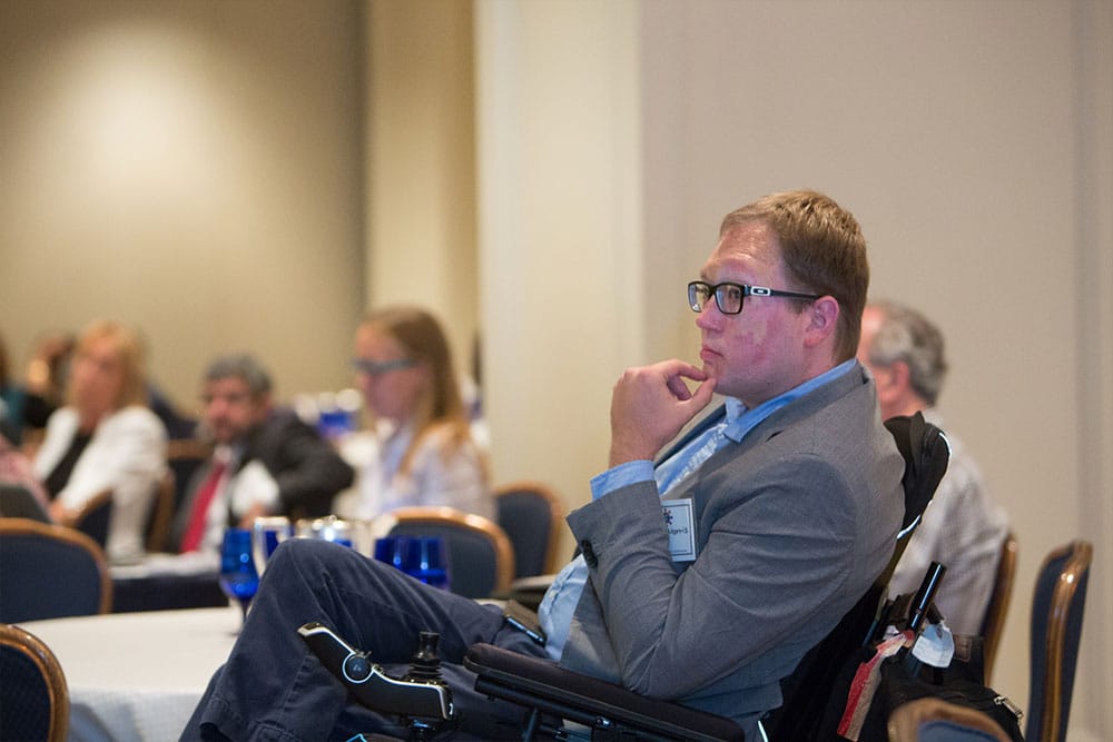 John Morris listening to a panel of TSA security officers.