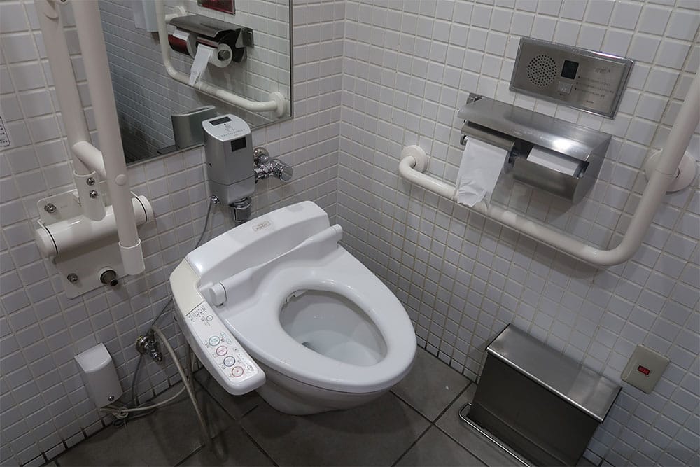 Wheelchair accessible toilet with grab bars in Tokyo, Japan.
