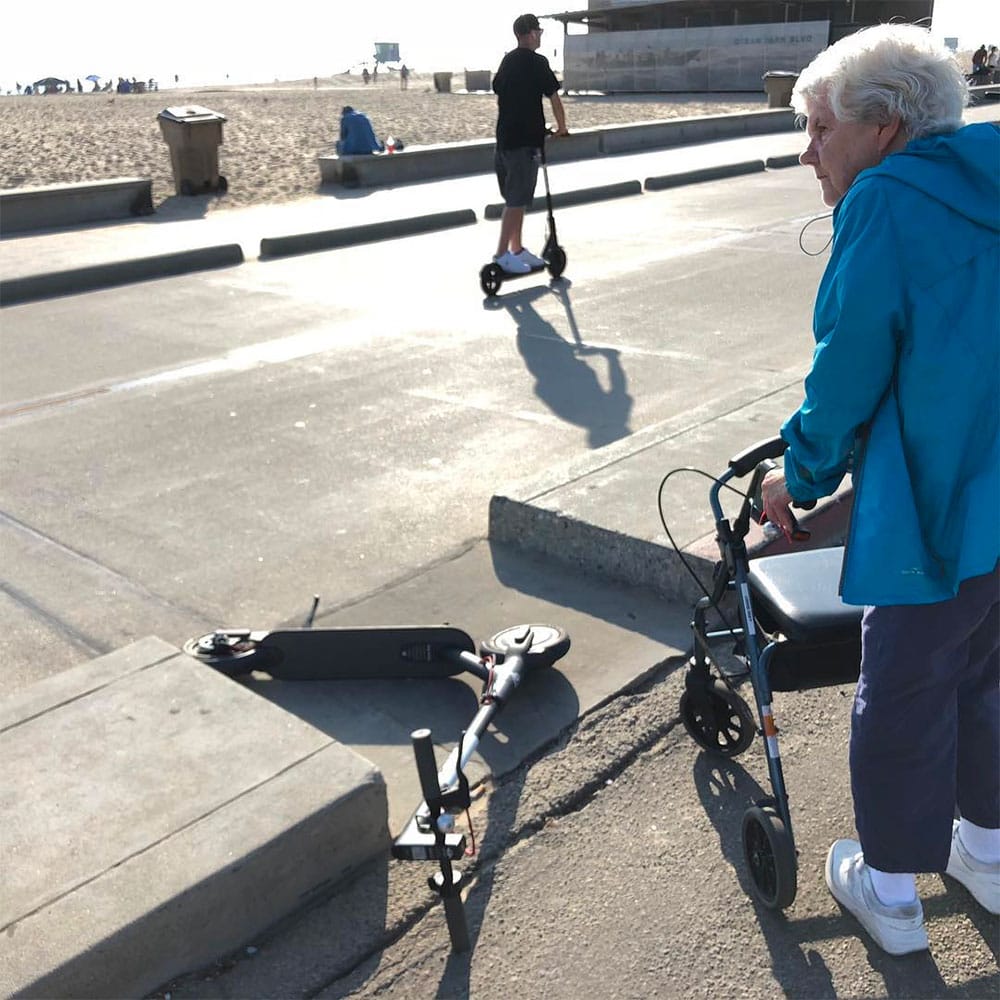 Bird scooter blocks elderly woman with walker in Venice, CA.