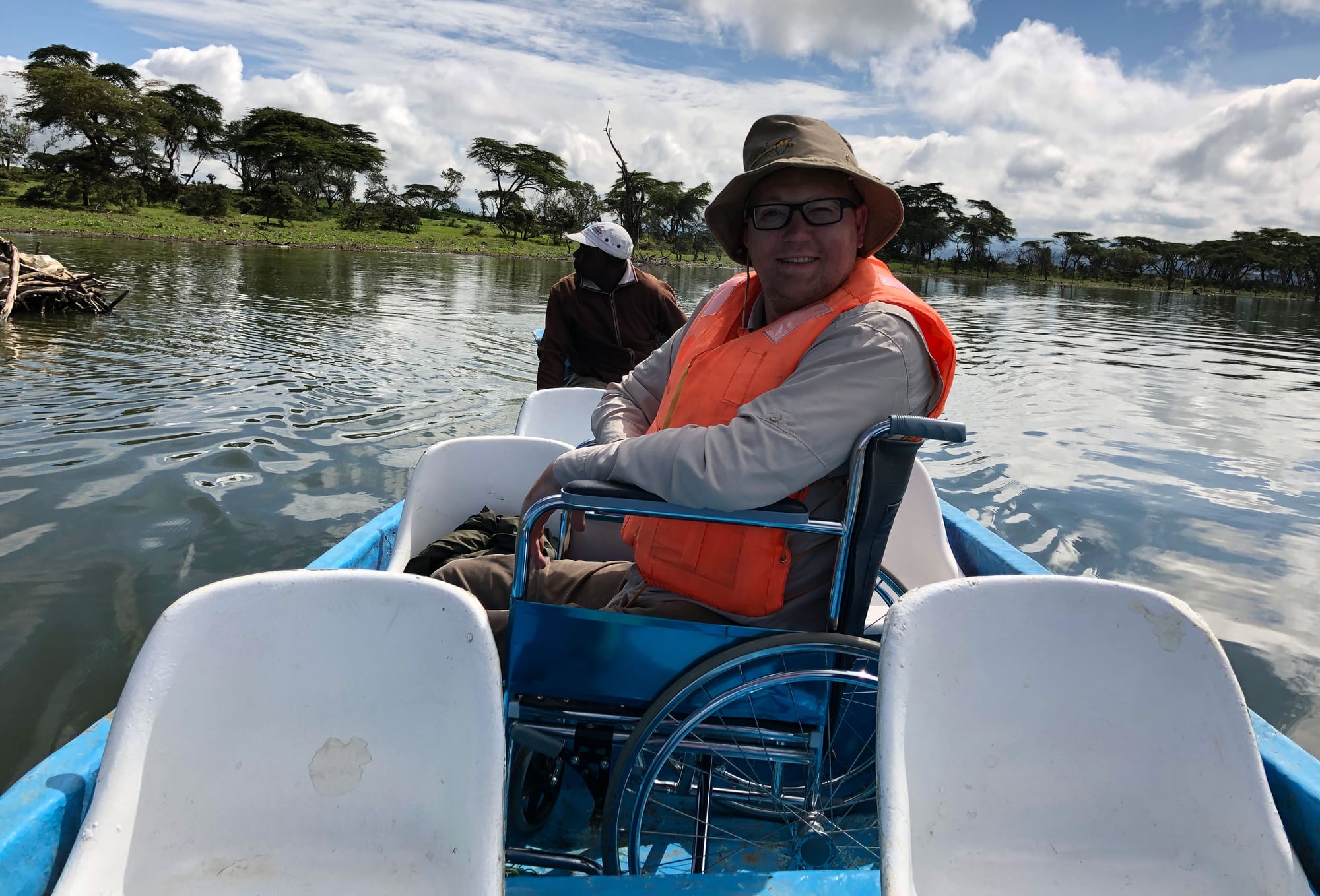 Manual wheelchair in boat on Lake Naivasha.