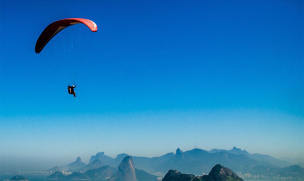 Stock photo: Sky diver attached to parachute.