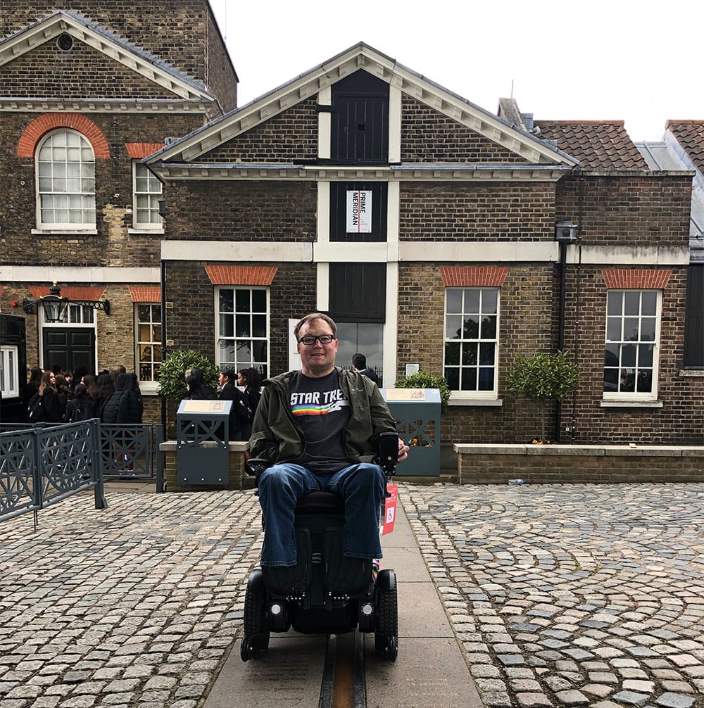 Wheelchair straddling the Prime Meridian at the Royal Observatory, Greenwich.