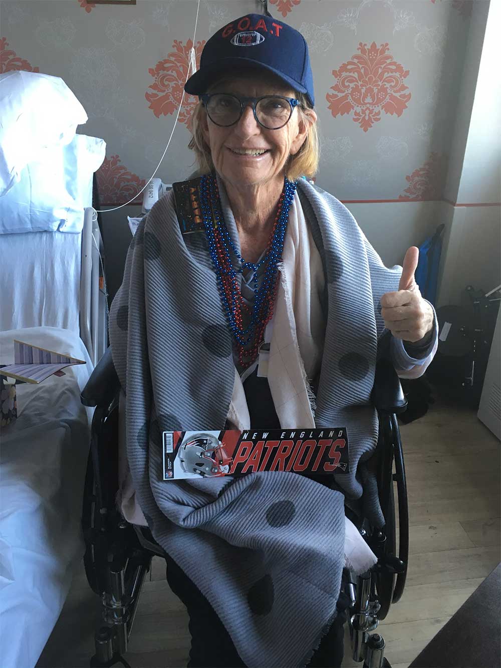 Woman seated in a wheelchair.