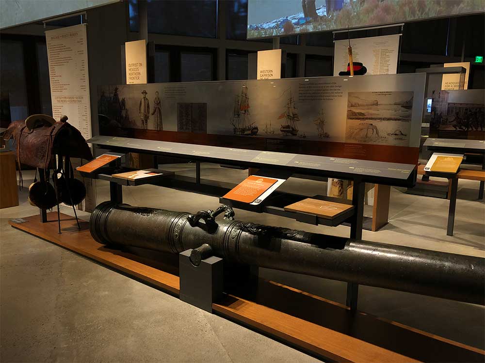 Large cannon in a museum exhibit.