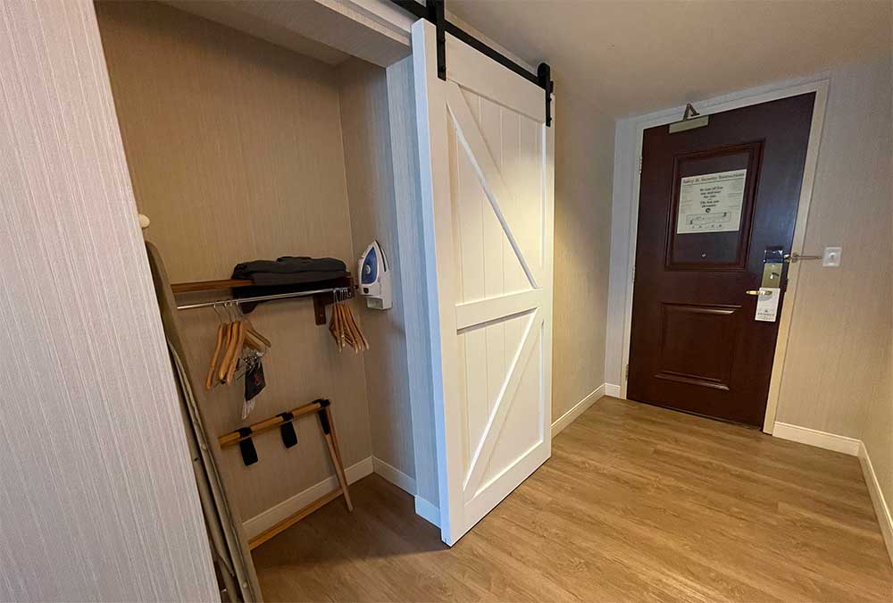 Closet with lowered clothes hanging rod.