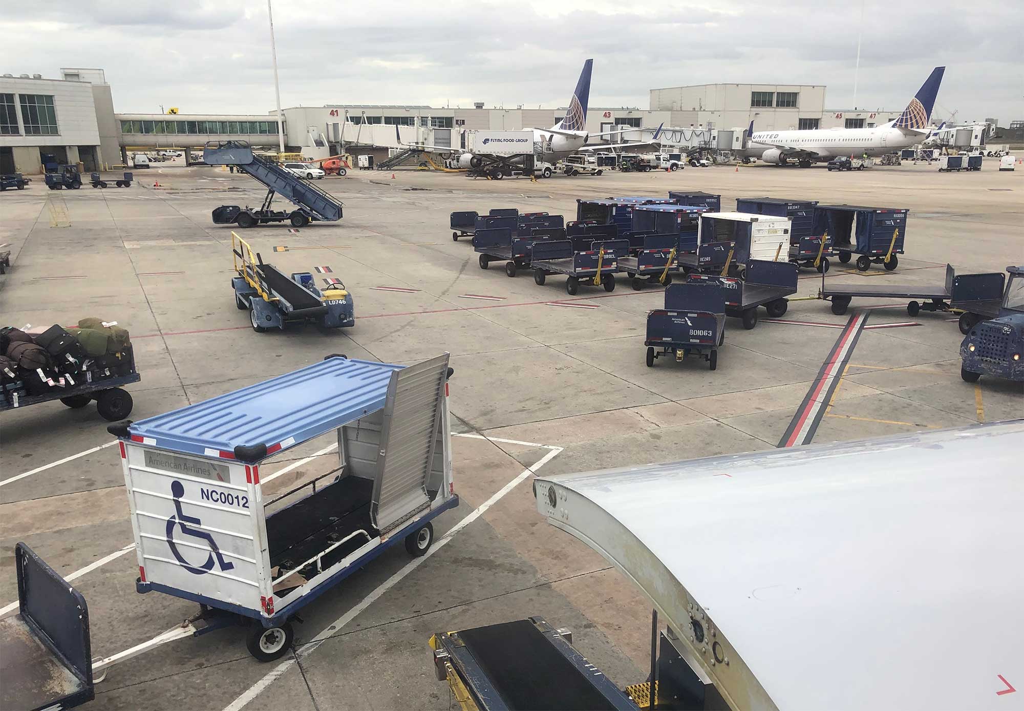 Baggage cart with wheelchair ramp.