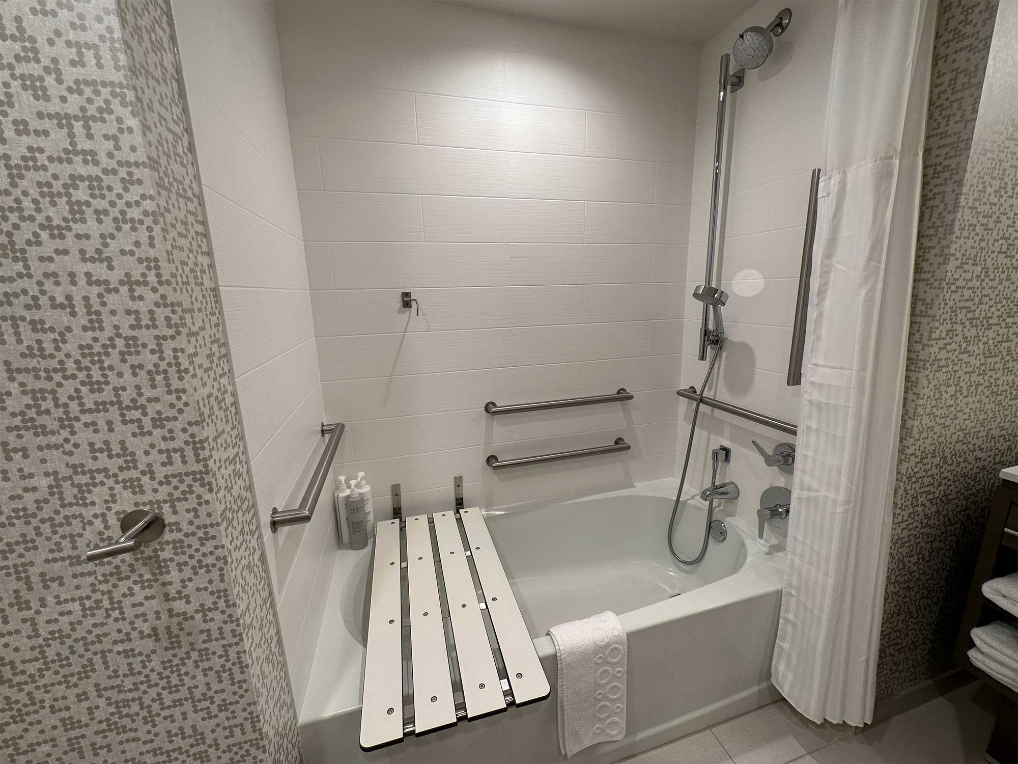 Bathtub with accessible seat.