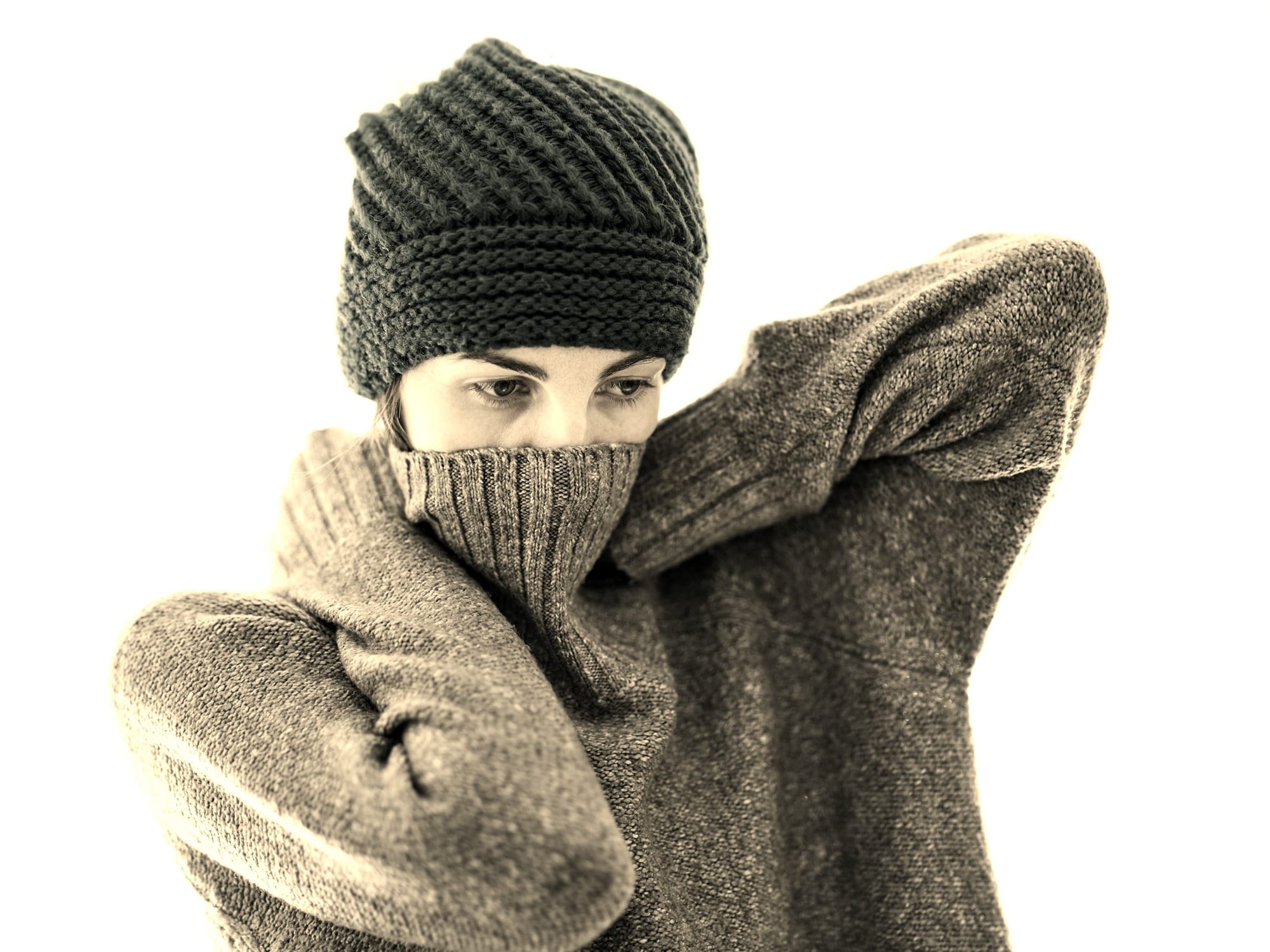 a woman wearing a knitted hat and scarf