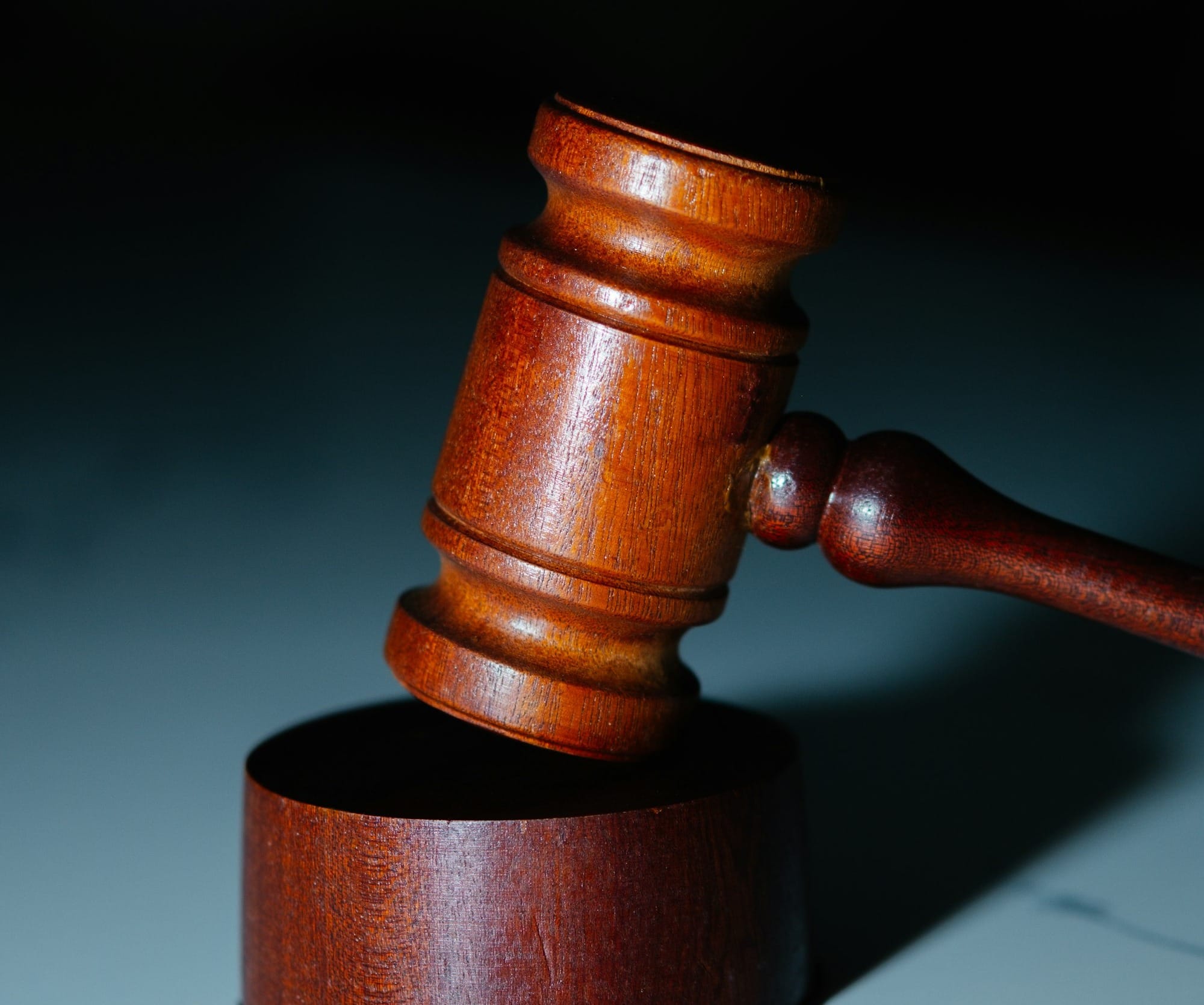 a wooden judge's hammer on top of a table