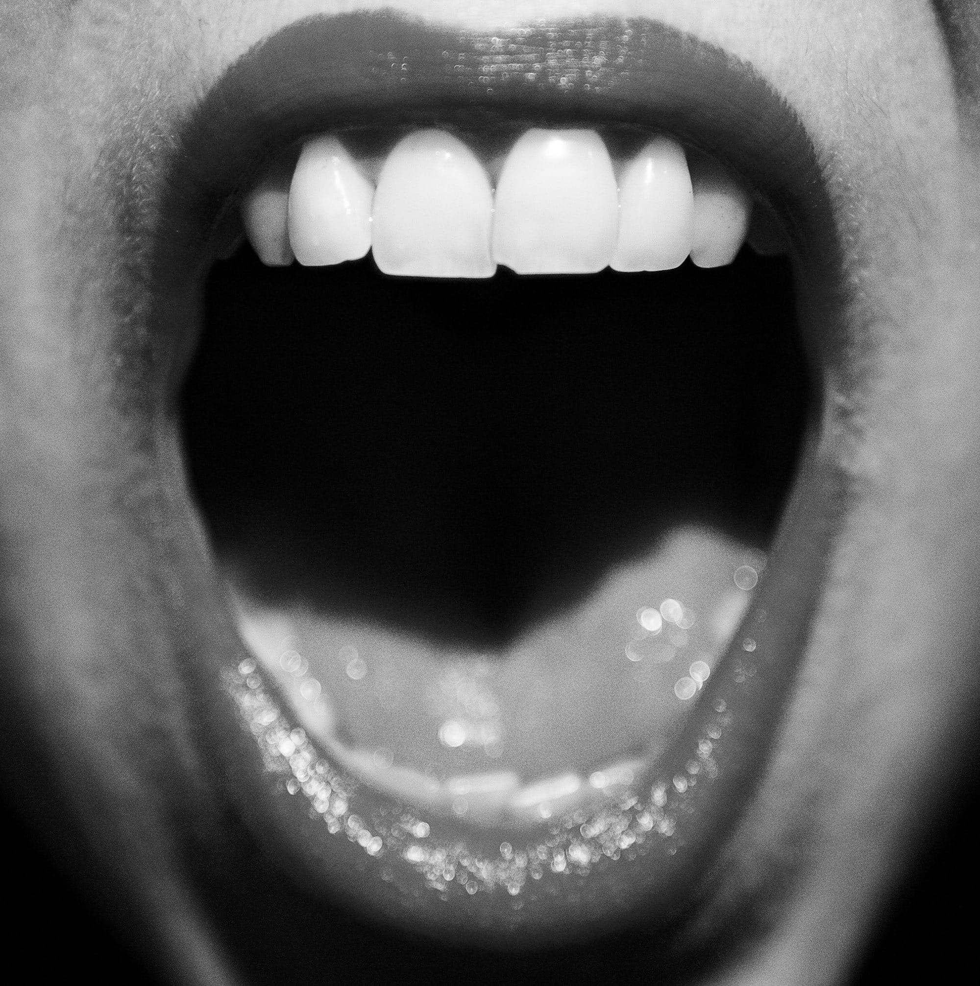 a close up of a person with their mouth open
