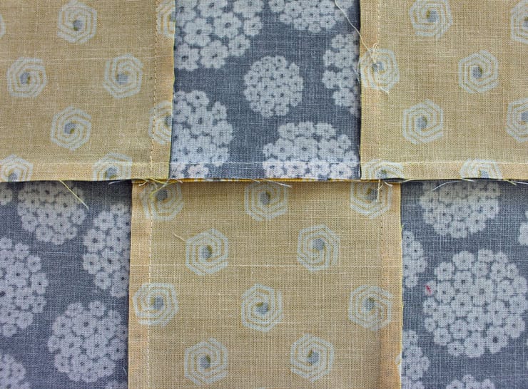 Pressing the back side of the quilt completely flat with seams going the right directions.