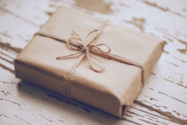 gift made of wood lying on rugged wood representing why bad things happen to good people