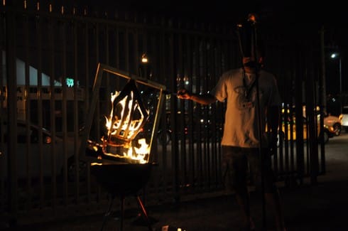 A Stikman burns in the night.