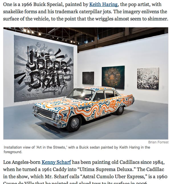 A 1966 Buick Special painted by Keith Haring in front of a large work by Retna. They are on display at MOCA's "Art in the Streets."