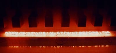 A detail of Chabet's "10,000 Paintings I Must Paint Before I Die", a conceptual installation of black plywood boxes suggesting the potential of the canvas.