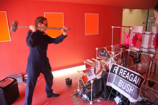 Brica Wilcox begins the destruction on day two with a sledge hammer. Photo by Jeremy Glaholt.