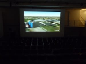 ETAK- a TomTomopera screened within a large theater space.