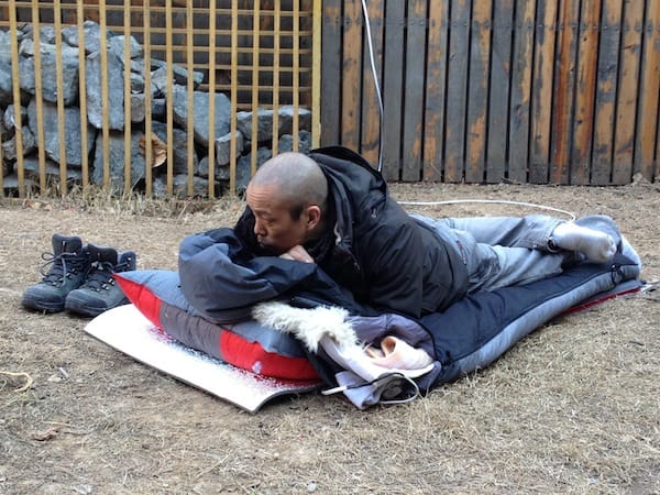Artist He Yunchang (aka A Chang) is sleeping outside in Beijing's Caochangdi art village till the grass grows. All photos by xingrui_beijing.