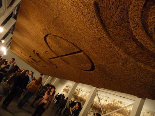Cai's Crop Circles are installed upside down above the crowd.