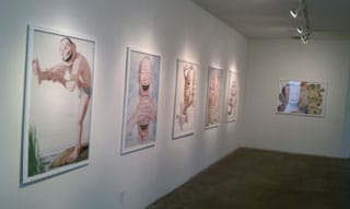 Installation view, works by Yue Minjun at Carmichael Gallery