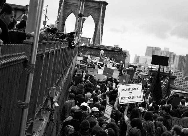Occupiers on the Brooklyn Bridge. Photo by author.