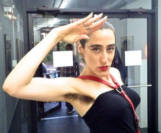 Ladyfag gives a jaunty military salute.