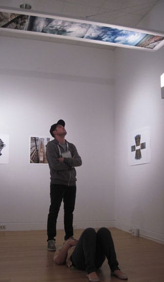 Viewers looking at one of Bash's vertical panoramas