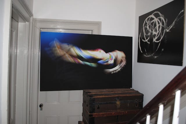 Photographs by Peter Angelo Simon displayed in his hallway