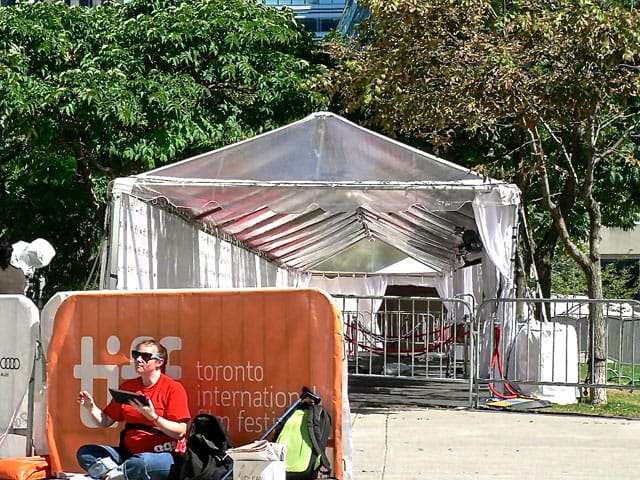 A TIFF fan stakes out her spot alongside the red carpet
