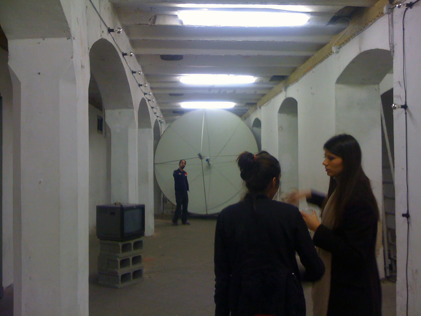 installation-in-progress at Cripta 747, artist Kianoosh Motallebi, co-founder Elisa Troiano, and curator Sara De Chiara