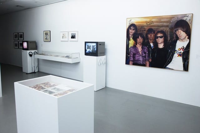 Installation view including Curt Hoppe, Bettie & the Ramones, oil on canvas after a photograph by Marc H. Miller and Bettie Ringma, 1978.  (Courtesy New Museum, New York. Photo: Jesse Untracht-Oakner)