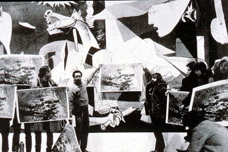 Members of the Art Workers’ Coalition demonstrating in front of Pablo Picasso's painting, Guernica, at MoMA in 1970 (photo courtesy Mousse Magazine)